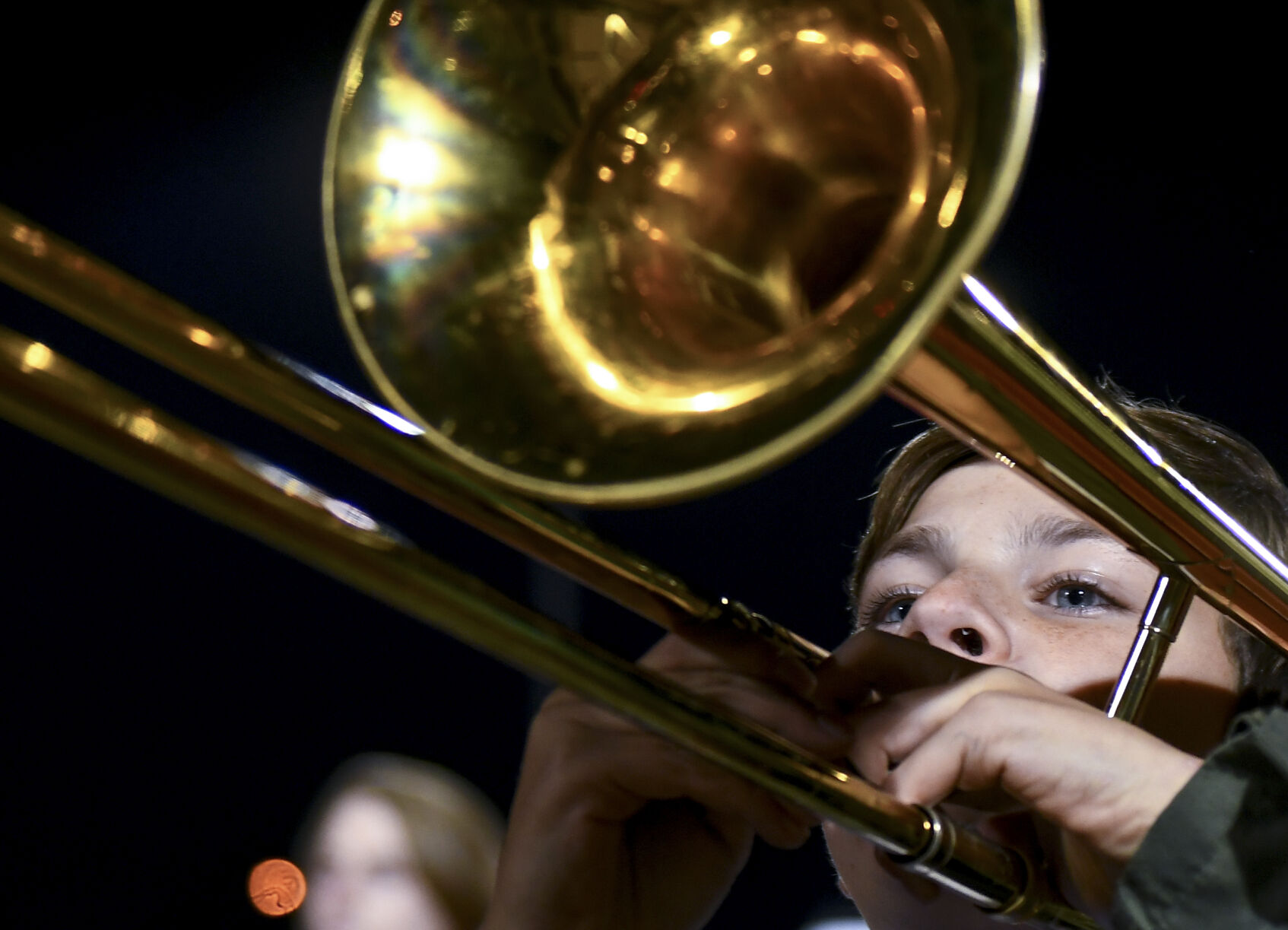 Freshman Aleck Lute plays the trombone during the Jefferson City High School marching band’s halftime performance